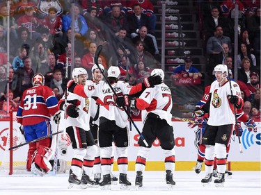 MONTREAL, QC - APRIL 24:  Erik Karlsson #65 of the Ottawa Senators celebrates his second period goal with teammates against the Montreal Canadiens during Game Five of the Eastern Conference Quarterfinals of the 2015 NHL Stanley Cup Playoffs at the Bell Centre on April 24, 2015 in Montreal, Quebec, Canada.