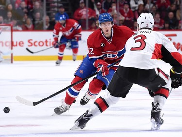 Dale Weise #22 of the Montreal Canadiens passes the puck in front of Marc Methot #3 of the Ottawa Senators during Game Five of the Eastern Conference Quarterfinals of the 2015 NHL Stanley Cup Playoffs at the Bell Centre on April 24, 2015 in Montreal, Quebec, Canada.