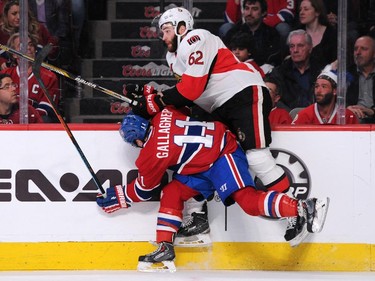 Brendan Gallagher #11 of the Montreal Canadiens body checks Eric Gryba #62 of the Ottawa Senators in Game Two of the Eastern Conference Quarterfinals during the 2015 NHL Stanley Cup Playoffs at the Bell Centre on April 17, 2015 in Montreal, Quebec, Canada.