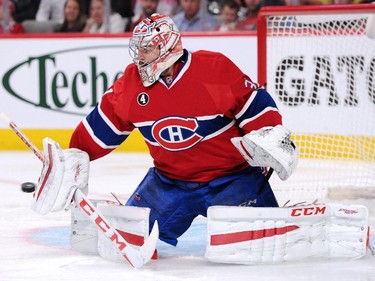 Carey Price #31 of the Montreal Canadiens makes a blocker save on the puck in Game Two of the Eastern Conference Quarterfinals during the 2015 NHL Stanley Cup Playoffs at the Bell Centre on April 17, 2015 in Montreal, Quebec, Canada.