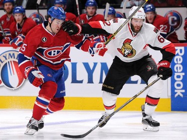 Eric Gryba #62 of the Ottawa Senators defends against P.A. Parenteau #15 of the Montreal Canadiens in Game One of the Eastern Conference Quarterfinals during the 2015 NHL Stanley Cup Playoffs at the Bell Centre on April 15, 2015 in Montreal, Quebec, Canada.