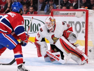 Andrew Hammond #30 of the Ottawa Senators stops the puck on an attempt by David Desharnais #51 of the Montreal Canadiens in Game One of the Eastern Conference Quarterfinals during the 2015 NHL Stanley Cup Playoffs at the Bell Centre on April 15, 2015 in Montreal, Quebec, Canada.