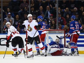 Mark Stone  celebrates a goal by Kyle Turris against the Rangers on Thursday night.