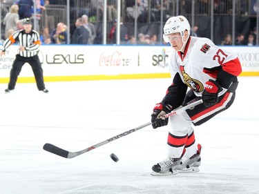 Curtis Lazar #27 of the Ottawa Senators skates with the puck against the New York Rangers.