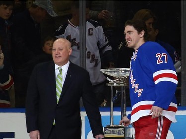 National Hockey League Deputy Commissioner Bill Daly presents the Presidents' Trophy to Ryan McDonagh #27 of the New York Rangers prior to the game.