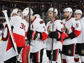 Andrew Hammond #30 of the Ottawa Senators celebrates with teammates after defeating the New York Rangers 3-0 at Madison Square Garden on April 9, 2015 in New York City.