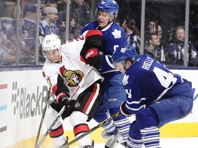Curtis Lazar is learning what it takes to win in hockey's trenches. Here he battles Jake Gardiner #51 and Morgan Rielly #44 of the Toronto Maple Leafs on Sunday.