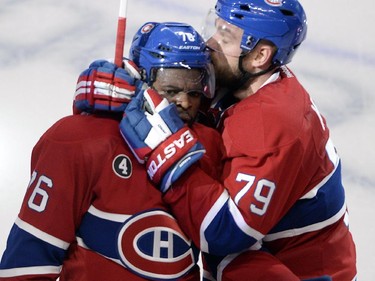 Montreal Canadiens defenseman P.K. Subban (76) gets a kiss from teammate Andrei Markov after scoring the second goal against the Ottawa Senators during second period of Game 2 NHL first round playoff hockey action Friday, April 17, 2015 in Montreal.