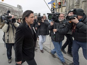 Suspended Sen. Patrick Brazeau leaves the courthouse in Ottawa after attending a day of the trial for Mike Duffy recently.