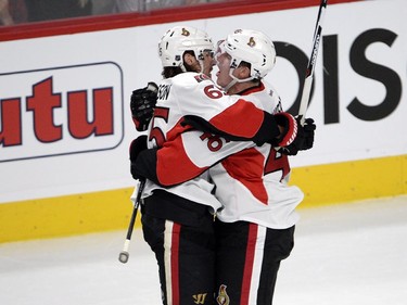 Ottawa Senators defenseman Patrick Wiercioch, right, celebrates with Ottawa Senators defenseman Erik Karlsson (65) after scoring the second goal of the game during third period of Game 2 NHL first round playoff hockey action against the Montreal Canadiens Friday, April 17, 2015 in Montreal.