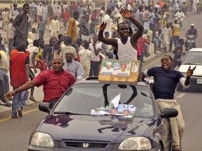 People celebrate though the streets of Kano, Nigeria, Wednesday, April 1, 2015, after Nigerian President elect Muhammadu Buhari won the Nigerian election.