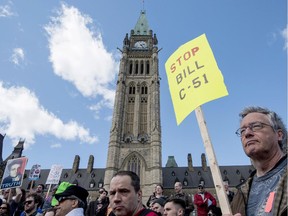 People protest on Parliament Hill during a day of action against Bill C-51, the government's proposed anti-terrorism legislation, Saturday, April 18.