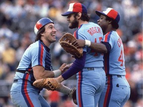 Montreal Expos Gary Carter (8), Steve Rogers (45), and Warren Cromartie (49) celebrate a win against the Philadelphia Phillies at Veterans Stadium in 1980.