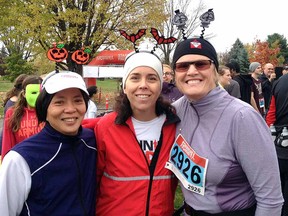 Karen Turner, right, and running mates Stella Caughey, left and Joanne Erbach, centre, were all smiles after completing the Running Scared 10k race on Oct. 25.