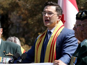 Pierre Poilievre tells told a crowd of Vietnamese Canadians gathered to commemorate the inaugural Journey to Freedom Day that broad opposition to using a prominent downtown site for a memorial for the victims of communism was 'shameful' and that the controversial monument will get built.