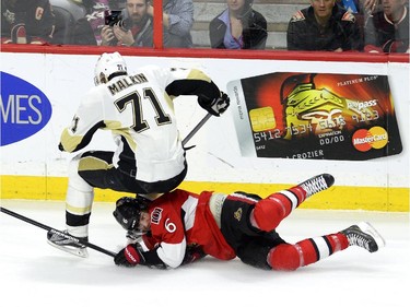 Pittsburgh Penguins' Evgeni Malkin (71) falls on Ottawa Senators' Bobby Ryan (6) second period NHL action.