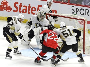 Pittsburgh Penguins goaltender Marc-Andre Fleury (29) watches the puck go in the net on a shot by Ottawa Senators' Jean-Gabriel Pageau (44), not shown, second period NHL action.
