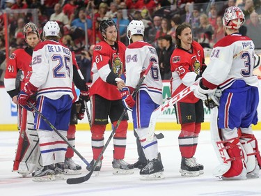 Players (from left) Craig Anderson, Jacob De La Rose, Mark Stone, Greg Pateryn, Erik Karlsson and Carey Price  line up for hand shakes after the third period as the Ottawa Senators take on the Montreal Canadiens at the Canadian Tire Centre in Ottawa for Game 6 of the NHL Eastern Conference playoffs on Sunday evening.