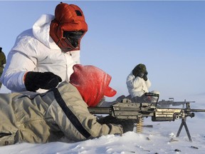 RESOLUTE BAY, Nunavut:   18 March, 2009 Resolute Bay, Nunavut  Canadian Ranger Gary Kalluk (foreground) fires the C9 Light Machine Gun during a live-fire range exercise in Resolute Bay, Nunavut.   Rangers are issued Lee Enfield .303 rifles, and were firing weapons supplied to the Winter Warfare Advanced course, who were conducting a live-fire small-arms shoot outside Resolute Bay, Nunavut.  The Canadian Forces have been conducting their Winter Warfare Advanced Course (WWAC) in the Northwest Territories and Nunavut. The High Arctic phase is being conducted in Resolute Bay, NU, from March 3rd to March 21st, 2009. The aim of this training is to hone CF members' skills while operating in an arctic environment and demonstrate proficiency in fieldcraft, equipment operation, safety standards, survival techniques, and navigation. Developing these skills ensures that the WWAC will produce military specialists capable of advising commanders on the organization and execution of northern sovereignty operations.   A key element of this training focuses on working in close coordination and benefitting from the knowledge of the people of Canada's North.   Photo by: Master Corporal Kevin Paul, Canadian Forces Combat Camera