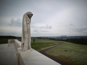 A sculpture entitled 'Mother Canada' looks out from the Canadian National Vimy Memorial on March 26, 2014 in Vimy, France.