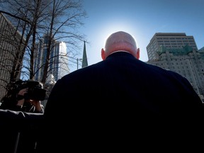 Sen. Mike Duffy is surrounded by media after he leaves court at the end of day six in his trial Tuesday.