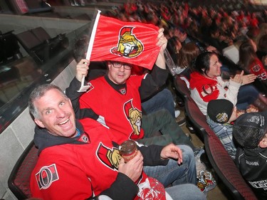 Stéphane Mazerall (L) and François Plourde enjoy the playoff action opposing the Ottawa Senators and the Montreal Canadiens at Canadian Tire Centre, April 24, 2015.