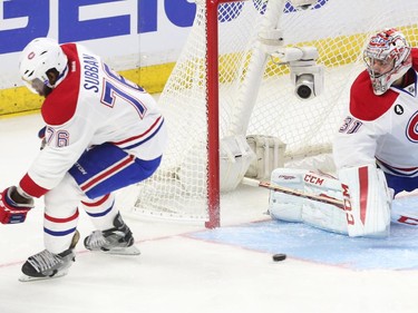 The Ottawa Senators thread the puck between P.K. Subban and Carey Price of the Montreal Canadiens during first period action.