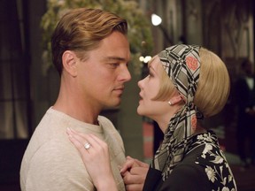 This film publicity image released by Warner Bros. Pictures shows Carey Mulligan as Daisy Buchanan, right, and Leonardo DiCaprio as Jay Gatsby in a scene from "The Great Gatsby."