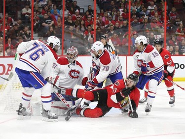 Mika Zibanejad of the Ottawa Senators battles against P.K. Subban, Carey Price, Andrei Markov and Pierre-Alexandre Parenteau of the Montreal Canadiens during second period of NHL action at Canadian Tire Centre in Ottawa, April 26, 2015.