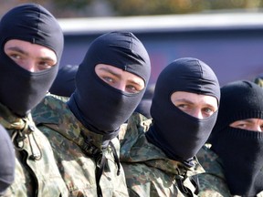 Servicemen of the pro-Ukrainian Azov battalion attend an oath-taking ceremony in Kiev on October 19, 2014.