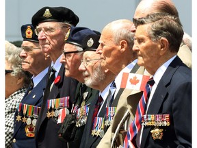 Veterans take part in a ceremony in Ottawa, Friday June 6, 2014 marking the 70th Anniversary of D-Day and the Battle of Normandy.