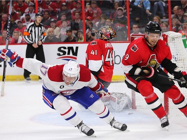Craig Anderson (top) and Milan Michalek of the Ottawa Senators show their dejection as Torrey Mitchell of the Montreal Canadiens celebrates Dale Weise overtime goal at Canadian Tire Centre in Ottawa, April 19, 2015.