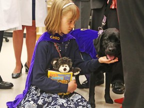 Sienna Knapp, 10, of Kingston has a rare genetic disease that give her seizures. She's helped by her dog, Jedi, trained to alert Sienna's parents when the girl has a seizure.