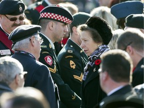 Cpl. Branden Stevenson (centre left) was on duty with Cpl Nathan Cirillo who was killed while on Guard of Honour duty Oct 22. Princess Anne greeted Stevenson on Remembrance Day.