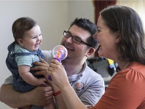 Paramedics Sean Hackett and Roxanne Kamula with their five-month-old  son, Archer. The family is bringing their community together to get more automated external defibrillators (AEDs) in public places, and to get more people trained in CPR.