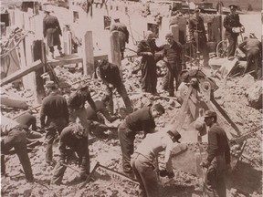 Workers comb through the rubble of Villa  St. Louis after the 1956 plane crash that killed 15.