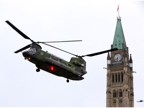 A Canadian Forces CH-147 Chinook helicopter prepares to land on Parliament Hill in Ottawa Thursday May 8, 2014.
