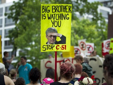 A group gathered at the Human Rights Monument to protest Bill C-51.