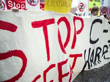 A group gathered at the Human Rights Monument on Elgin to protest the government's proposed anti-terrorism legislation, Bill C-51, Saturday, May 30, 2015.