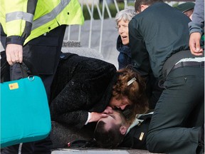 This photo of bystanders trying to save Cpl. Nathan Cirillo after he was shot at the National War Memorial was named Spot News Photo of the year by the News Photographers Association of Canada.