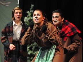 Alexandra Castellani(L), Chelsea Atwood and Brandon Hoang(R), perform as Lucy Pevensie and Mrs. and Mr. Beaver, during St. Joseph high School's Cappies production of The Lion, the Witch and the Wardrobe.