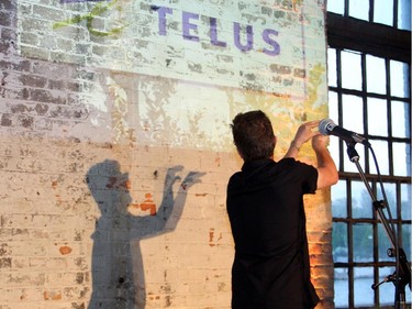 Andy Maize from the Skydiggers makes shadow puppets while performing at the Ottawa Riverkeeper Gala, held at Albert Island on the Ottawa River on Wednesday, May 27, 2015.