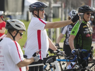 Aref El-Ghotmi (centre) takes a selfie before the start of the CN Cycle race. Nearly 1000 participance took part in the 70km CN Cycle for CHEO race in Ottawa, May 3, 2015.