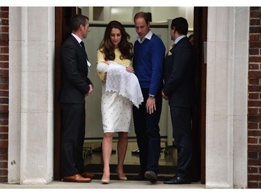 Britain's Prince William, Duke of Cambridge, walks with his wife Catherine, Duchess of Cambridge as she carries their newly-born daughter, their second child, out of the Lindo Wing at St Mary's Hospital in central London, on May 2, 2015.  The Duchess of Cambridge was safely delivered of a daughter weighing 8lbs 3oz, Kensington Palace announced. The newly-born Princess of Cambridge is fourth in line to the British throne.