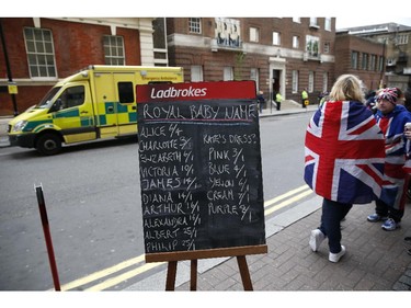A chalkboard displays the latest betting odds on the name of Catherine, Duchess of Cambridge and Prince William's second child outside the entrance to the Lindo wing at St Mary's hospital in central London, on May 2, 2015 after the announcement was made by Kensington Palace that Catherine was admitted to hospital on May 2 in the early stages of labour.