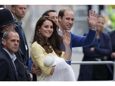 Britain's Prince William and Kate, Duchess of Cambridge and their newborn baby princess, wave to the public as they leave St. Mary's Hospital's exclusive Lindo Wing in London, Saturday, May 2, 2015.