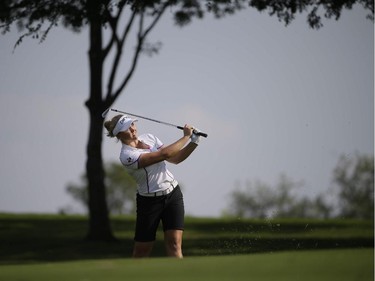 Brooke M. Henderson watches her approach shot on the ninth hole during the second round of the LPGA North Texas Shootout golf tournament, Friday, May 1, 2015, in Irving, Texas.