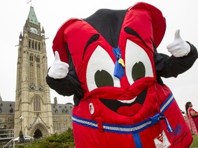 Buckles the Canadian Red Cross mascot for water safety, hams it up for National Lifejacket and Swim Day.
