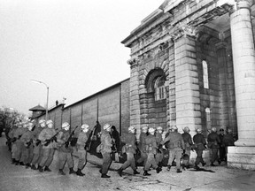 Canadian Armed Forces troops arrive at the Kingston penitentiary on April 15, 1971 to help prison oficials after inmates took control of the main cell block. The riot ended on April 18 with two inmates dead and 11 injured.