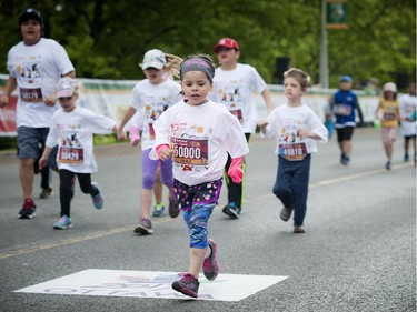 Charlie Legare pushing to the finish line during the kids marathon at Tamarack Ottawa Race Weekend, Sunday, May 24, 2015.